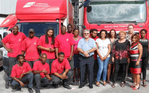 Staff AGS Movers Guiana with red removal trucks