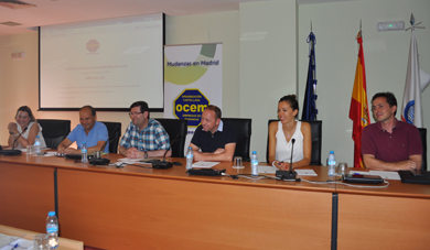 Table with speakers at a conference.