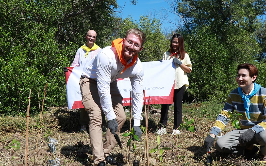 AGS Thailand employees planting mangrove saplings at Bangpu Nature Education Centre for their AMCHAM award-winning CSR initiative.
