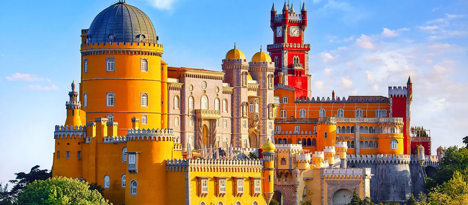 The vibrant and iconic Palácio da Pena in Sintra, showcasing romantic architecture and a legendary storybook appearance.
